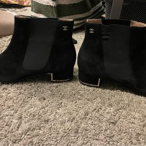 Black shirt suede and stretch booties with gold hardware detail. Great condition
